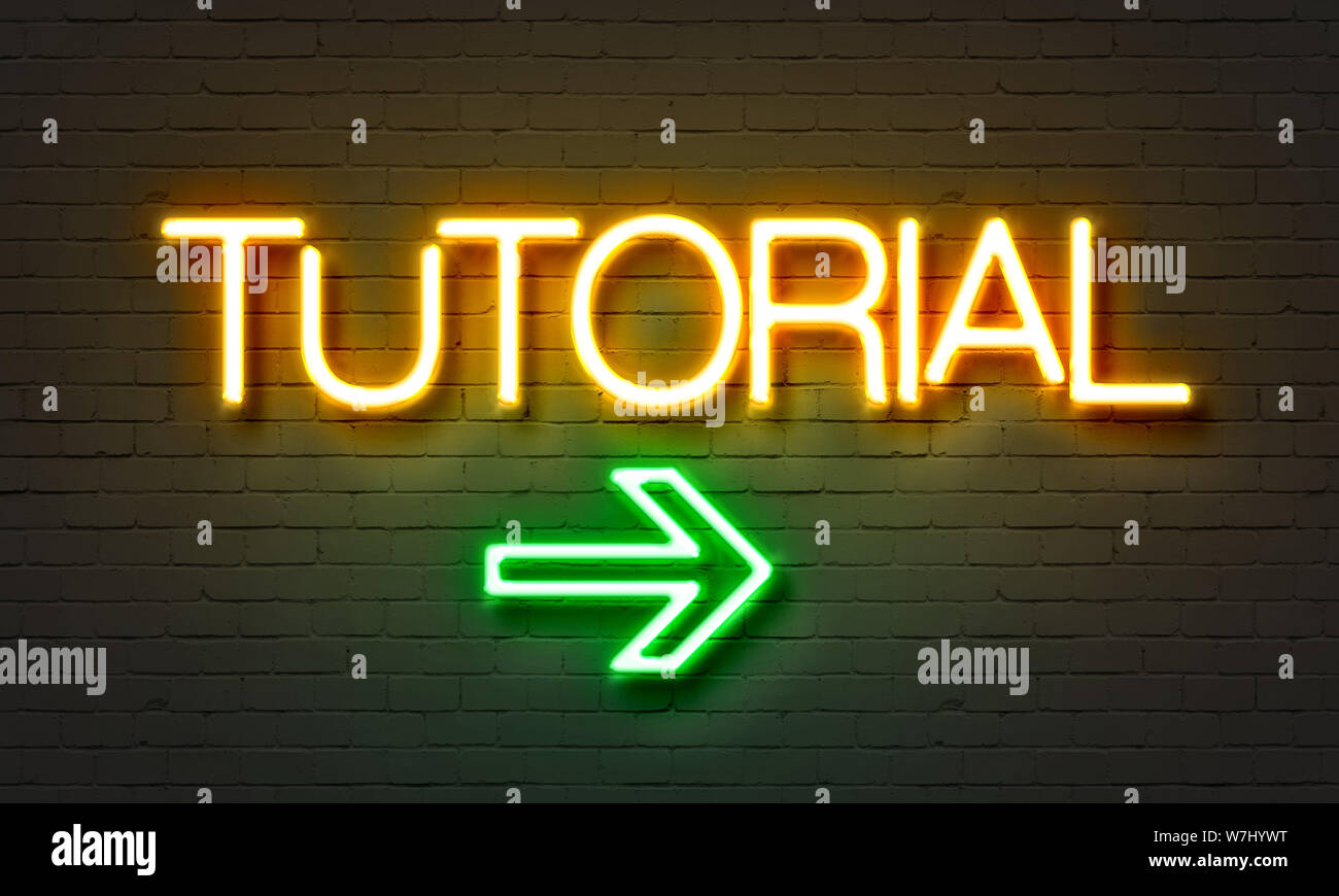Tutorial neon sign on brick wall background Stock Photo