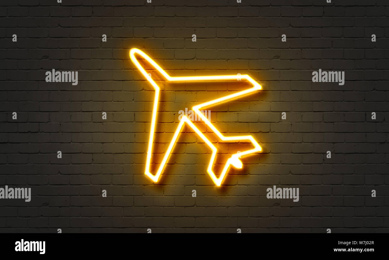 Airplane neon sign on brick wall background Stock Photo - Alamy