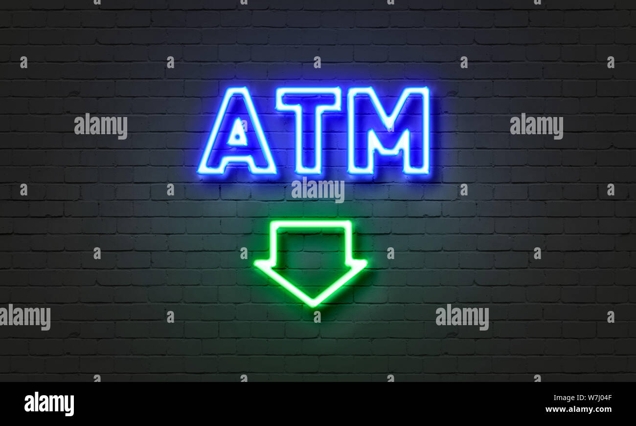ATM neon sign on brick wall background Stock Photo - Alamy