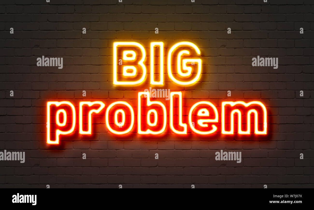 Big problem neon sign on brick wall background Stock Photo