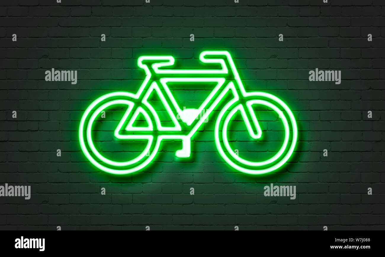 Bike icon neon sign on brick wall background Stock Photo - Alamy