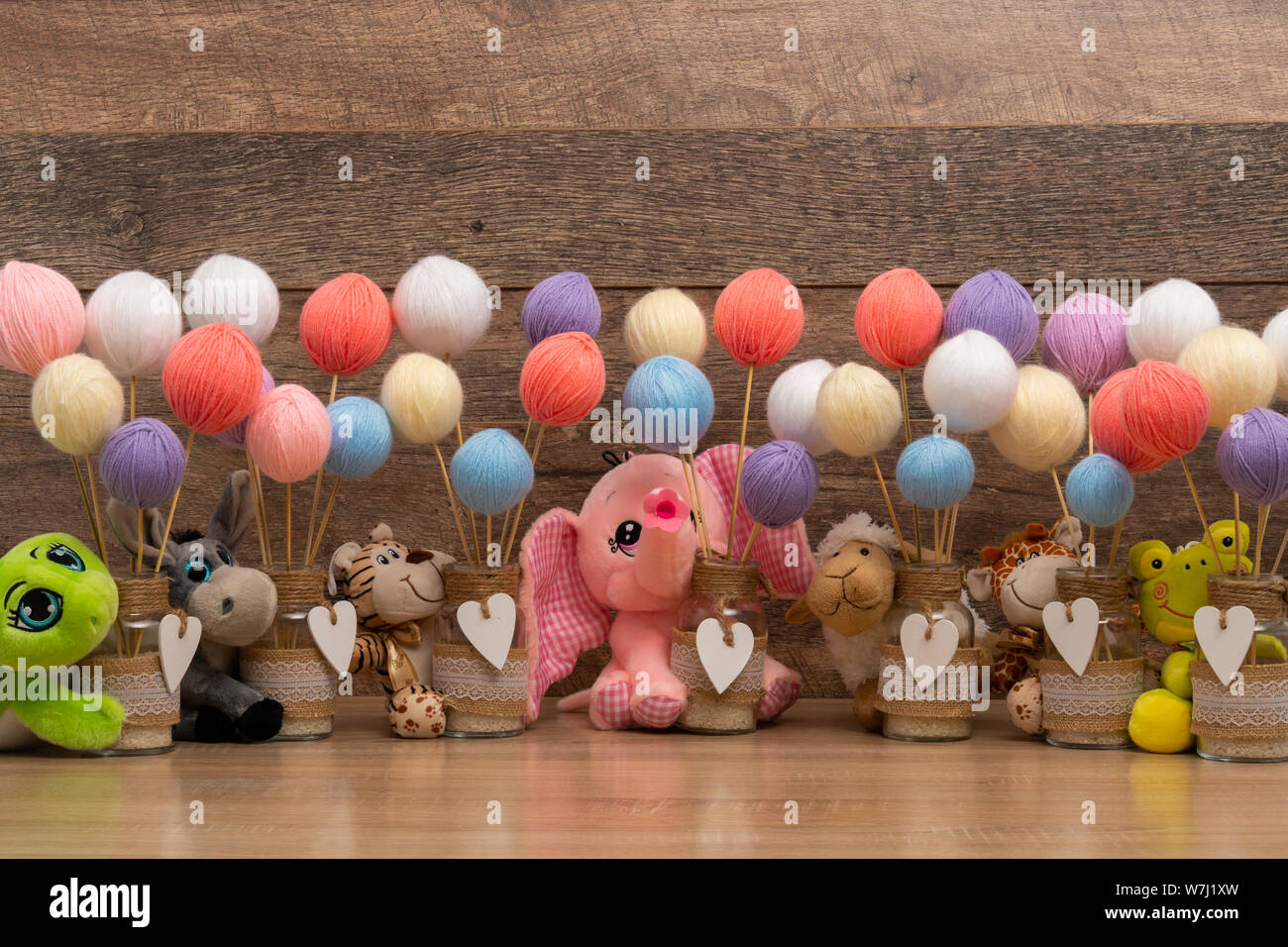Balls, sticks and baby dolls for christening Stock Photo Alamy