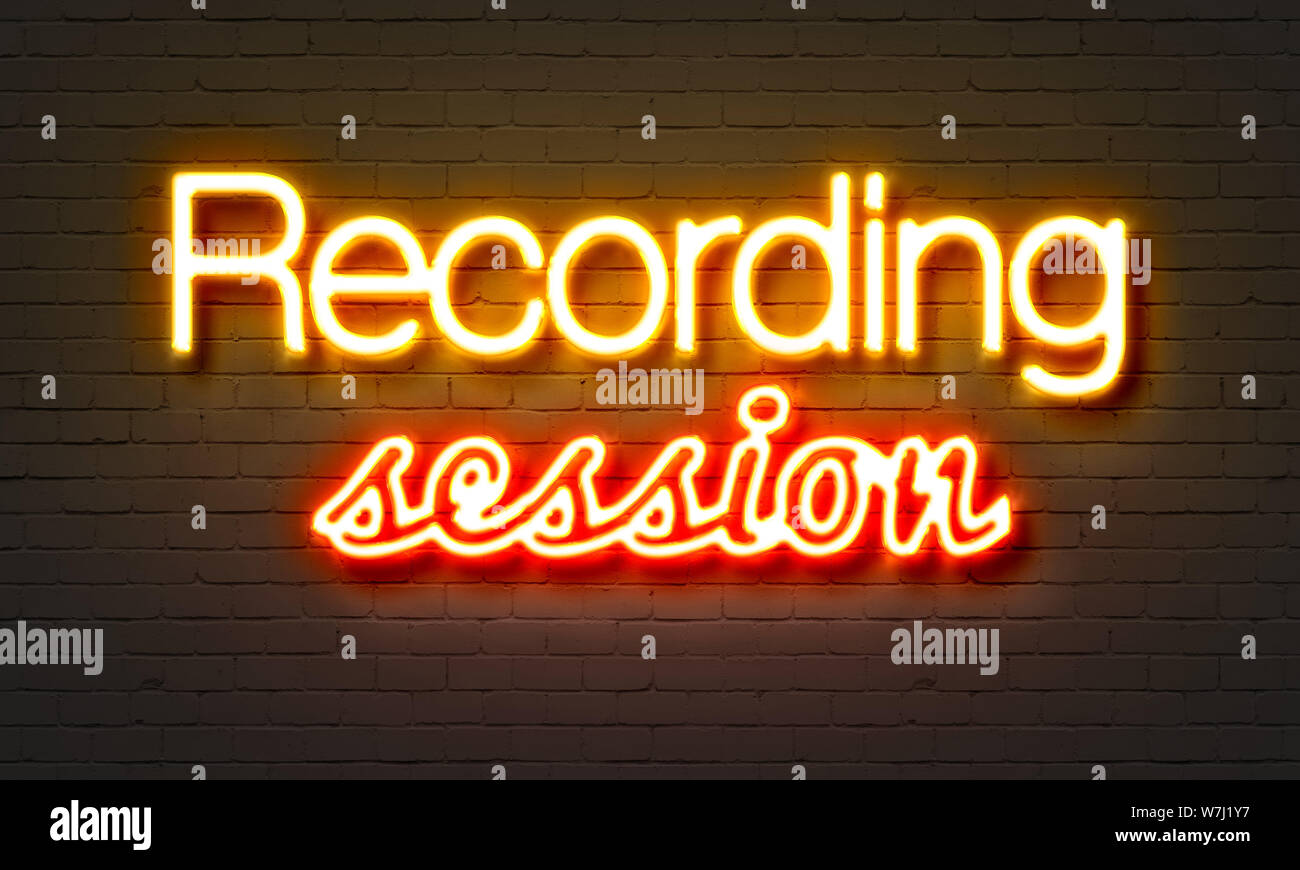 Recording session neon sign on brick wall background Stock Photo