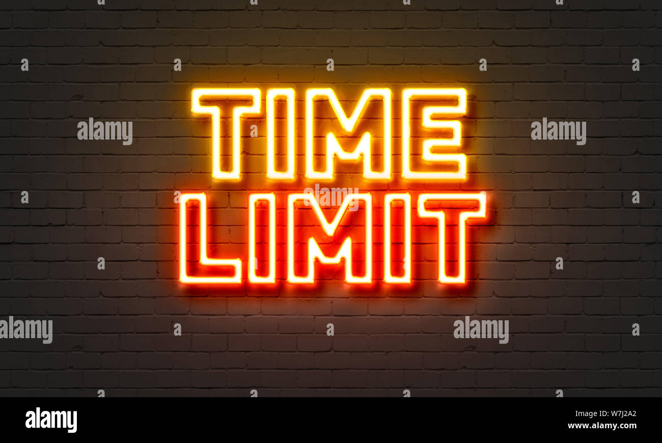 Time limit neon sign on brick wall background Stock Photo Alamy