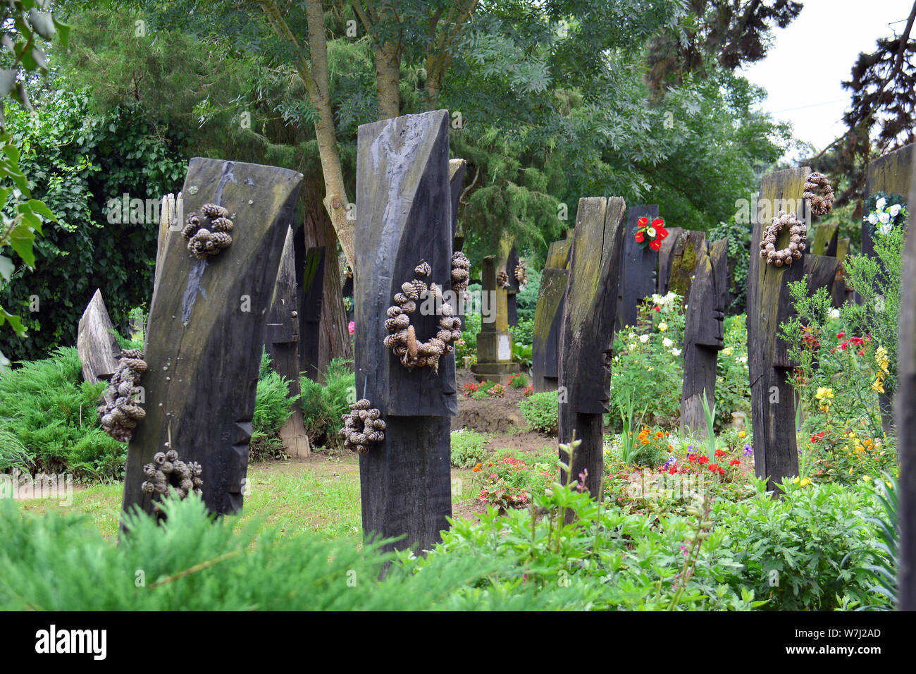 Wooden boat shaped headstones on the cemetery, Szatmárcseke, Hungary, Magyarország, Europe Stock Photo