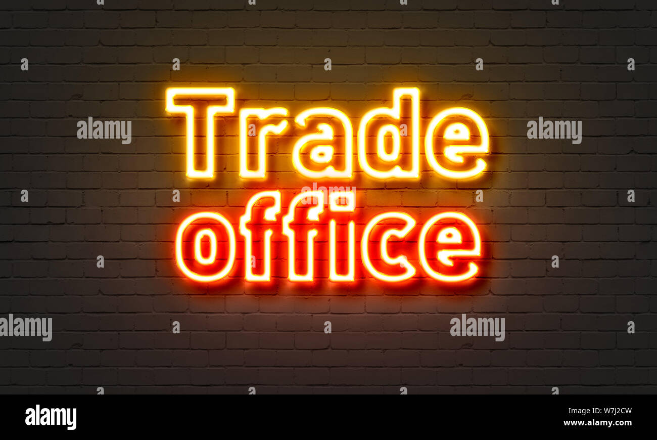 Trade office neon sign on brick wall background Stock Photo