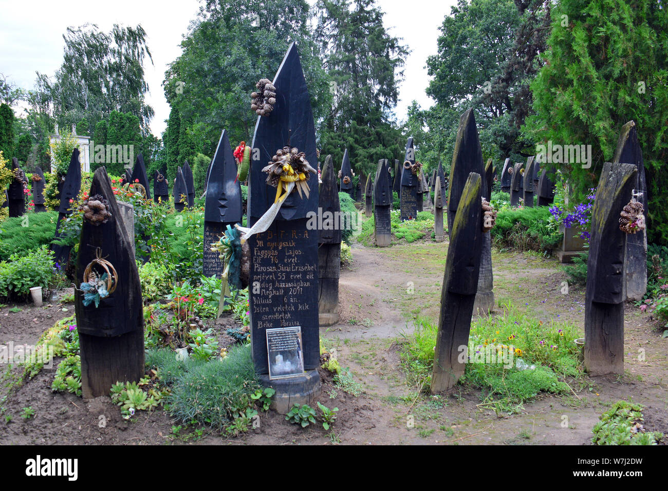 Wooden boat shaped headstones on the cemetery, Szatmárcseke, Hungary, Magyarország, Europe Stock Photo