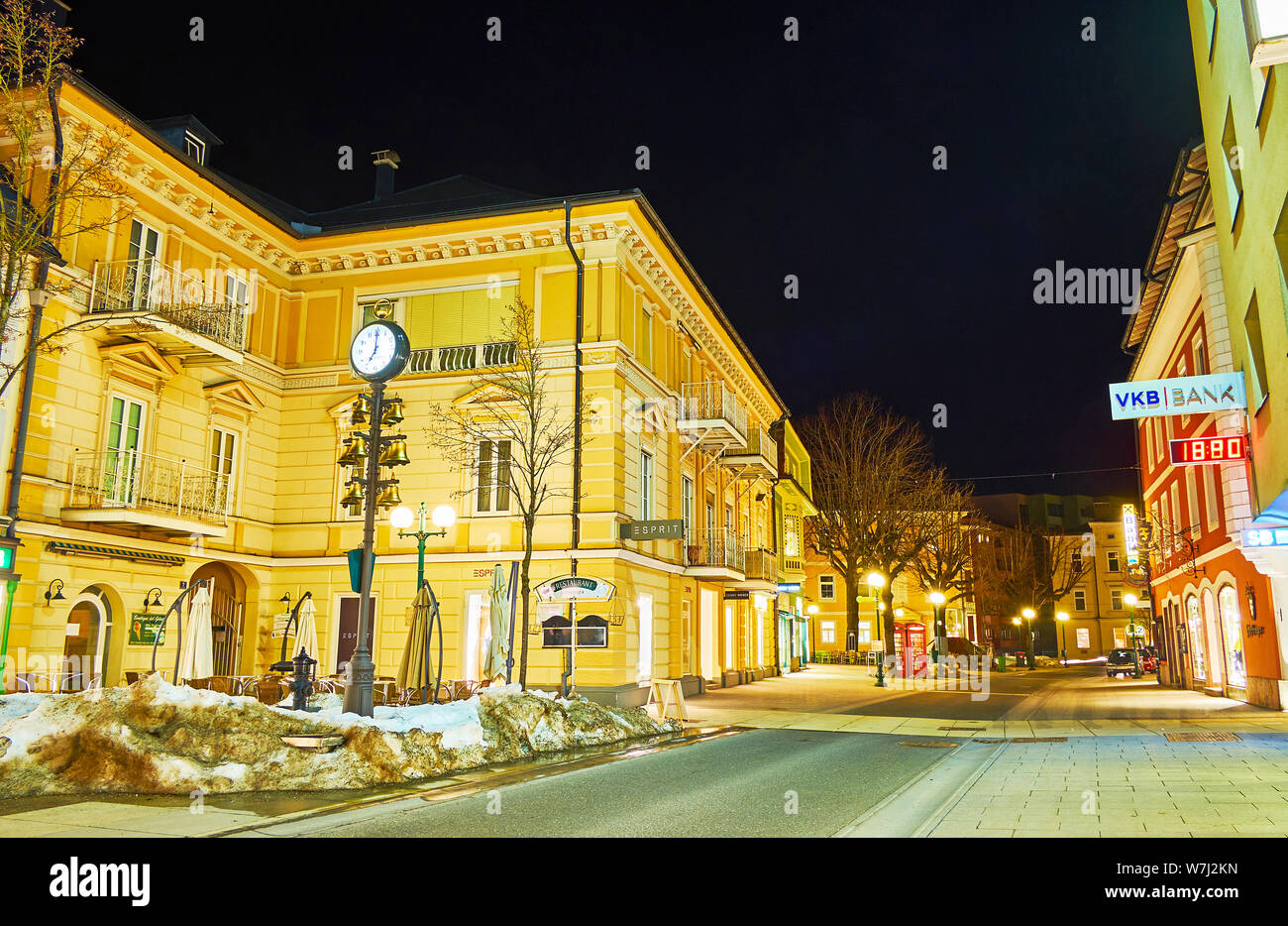 BAD ISCHL, AUSTRIA - FEBRUARY 26, 2019: The Kreuzplatz square looks great in the evening, its historical buildings are brightly illuminated and attrac Stock Photo