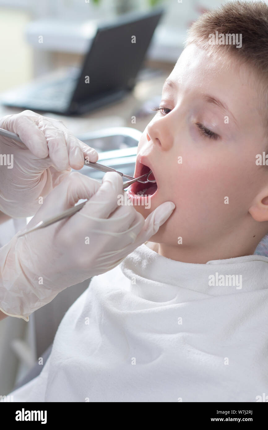 The Boy In The Dental Office During The Administration Of - 