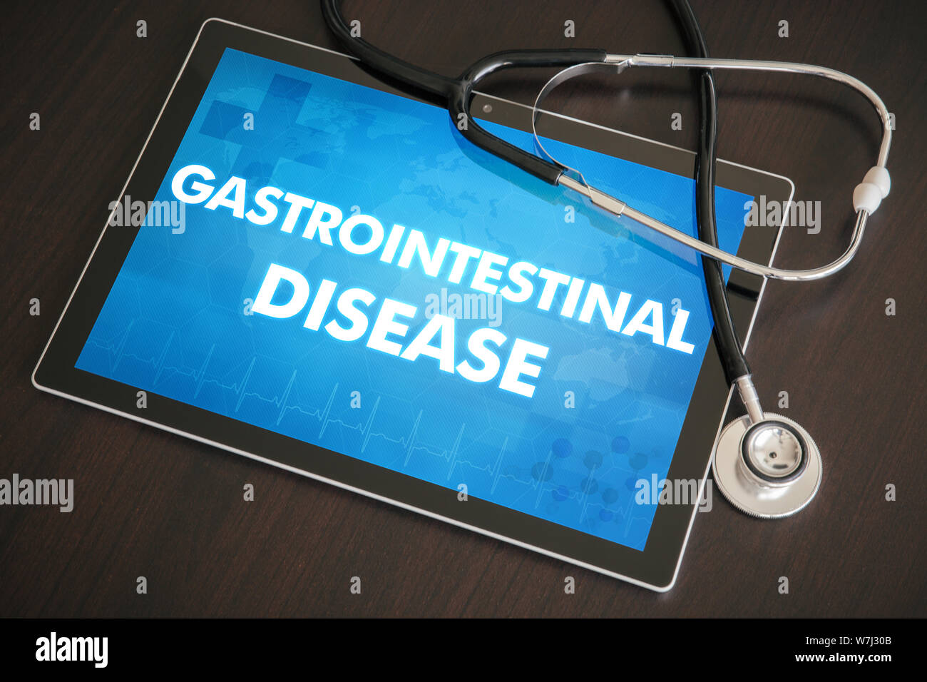 Gastrointestinal disease (stomach, tract, rectum) diagnosis medical concept on tablet screen with stethoscope. Stock Photo