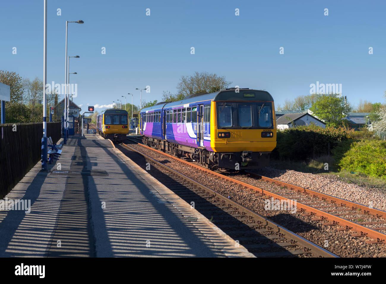 Arriva Northern rail class 142 pacer trains pass at Heighington station