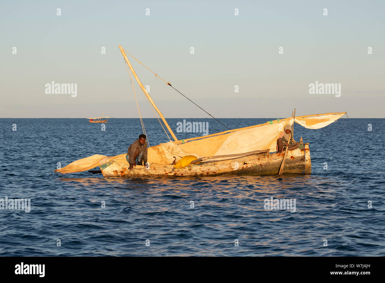 Africa, Madagascar, Anjajavy, local fishing boats and fishermen collecting their catch Stock Photo