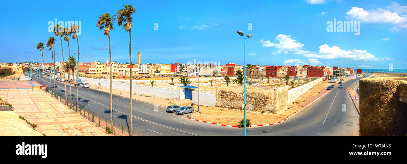 Panoramic cityscape with road along medina and colorful residential district in Essaouira. Morocco, Northern Africa Stock Photo