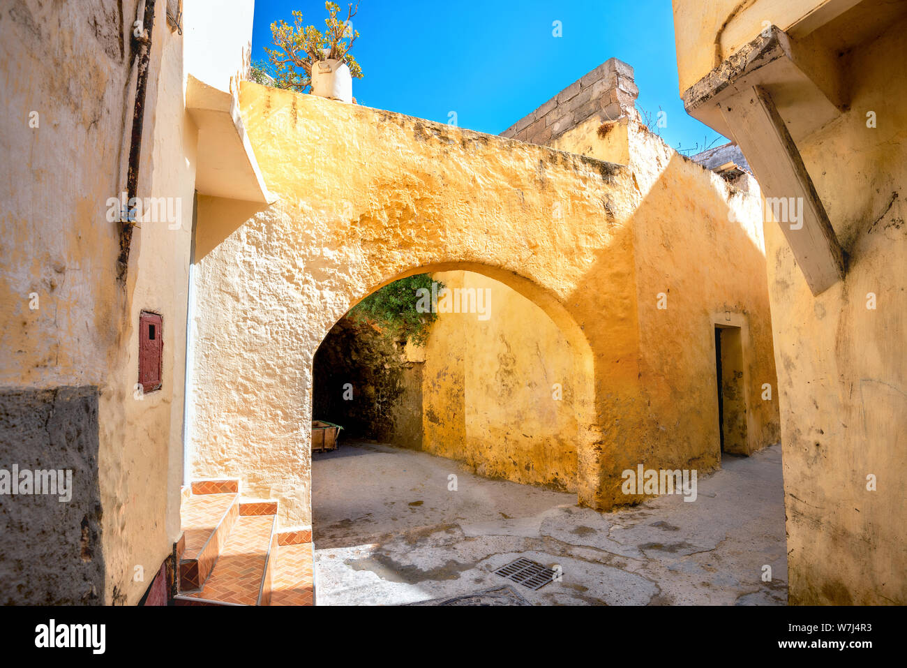 Typical alley with facade of residential houses in medina Essaouira. Morocco, North Africa Stock Photo