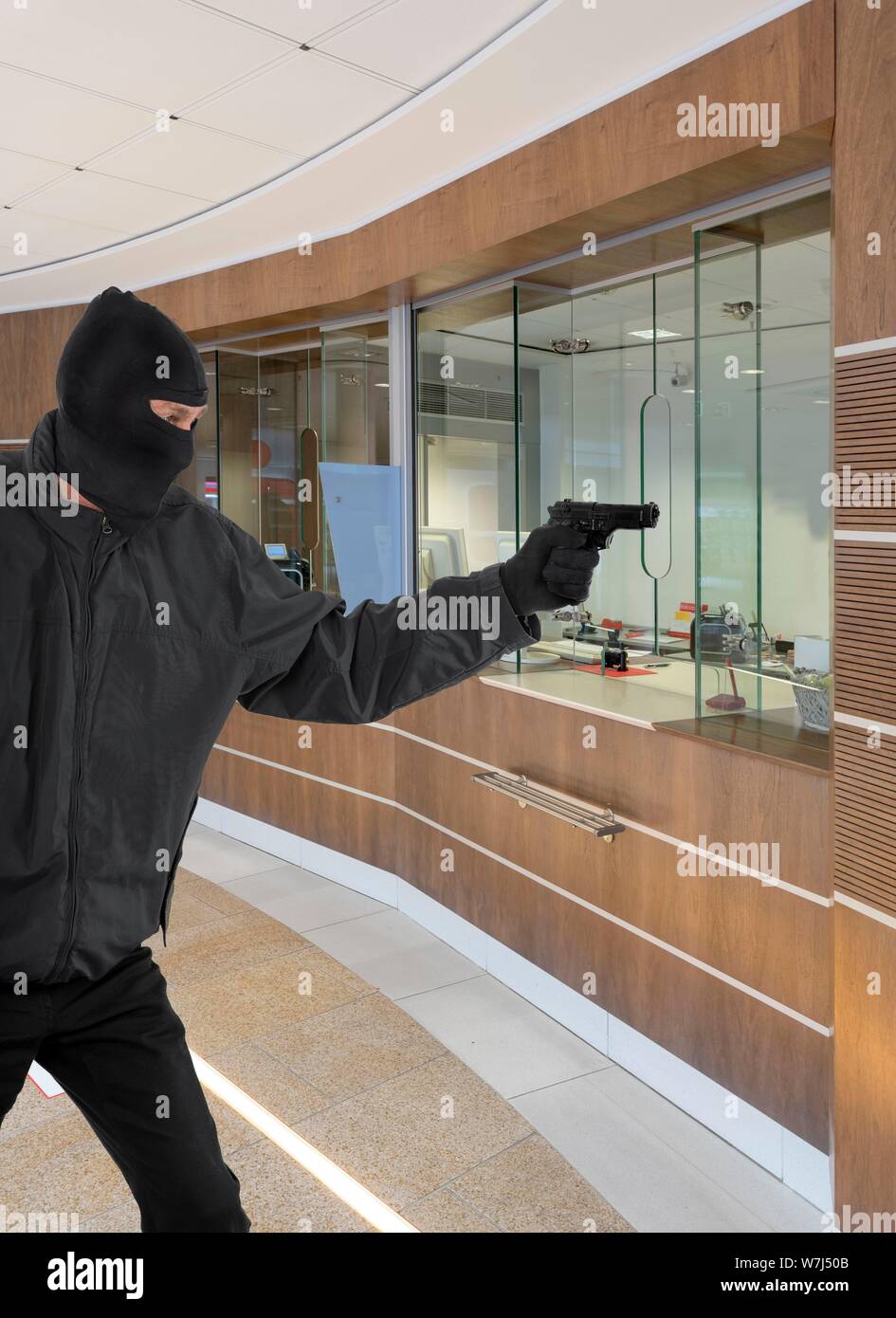 Bank robbery, gangster with pistol, Rinteln, Lower Saxony, Germany Stock Photo