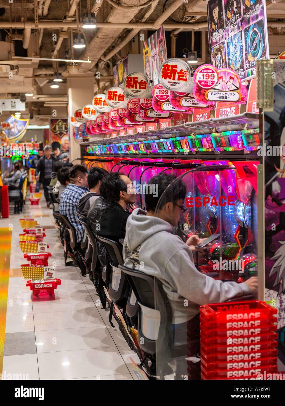 Players Sit At Slot Machines In A Casino Tokyo Japan Stock Photo Alamy