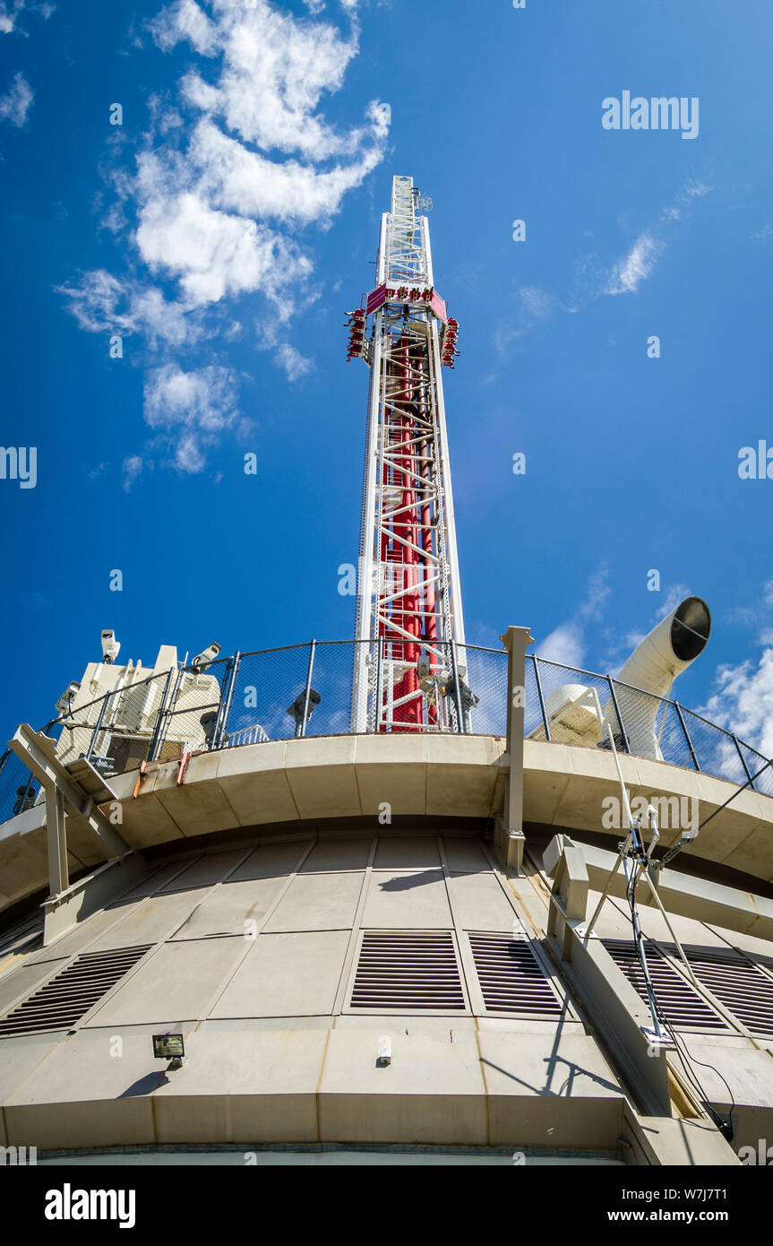 View at the top of the Stratosphere Hotel in Las Vegas, Nevada. The very  top of the tower, the 'Big Shot' ride, is pictured against a blue cloudy  sky. Copy space on