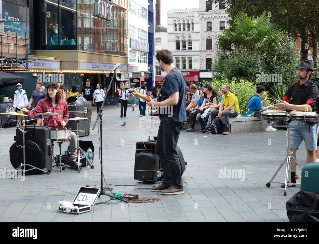Musicians buskers seen performing on the streets of London in the summer month of August Stock