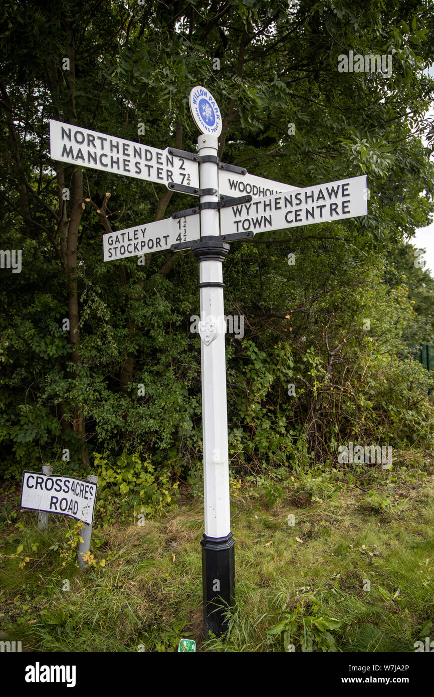 Metal finger signpost showing Manchester, Northenden, Gatley, Stockport, Wythenshawe Stock Photo