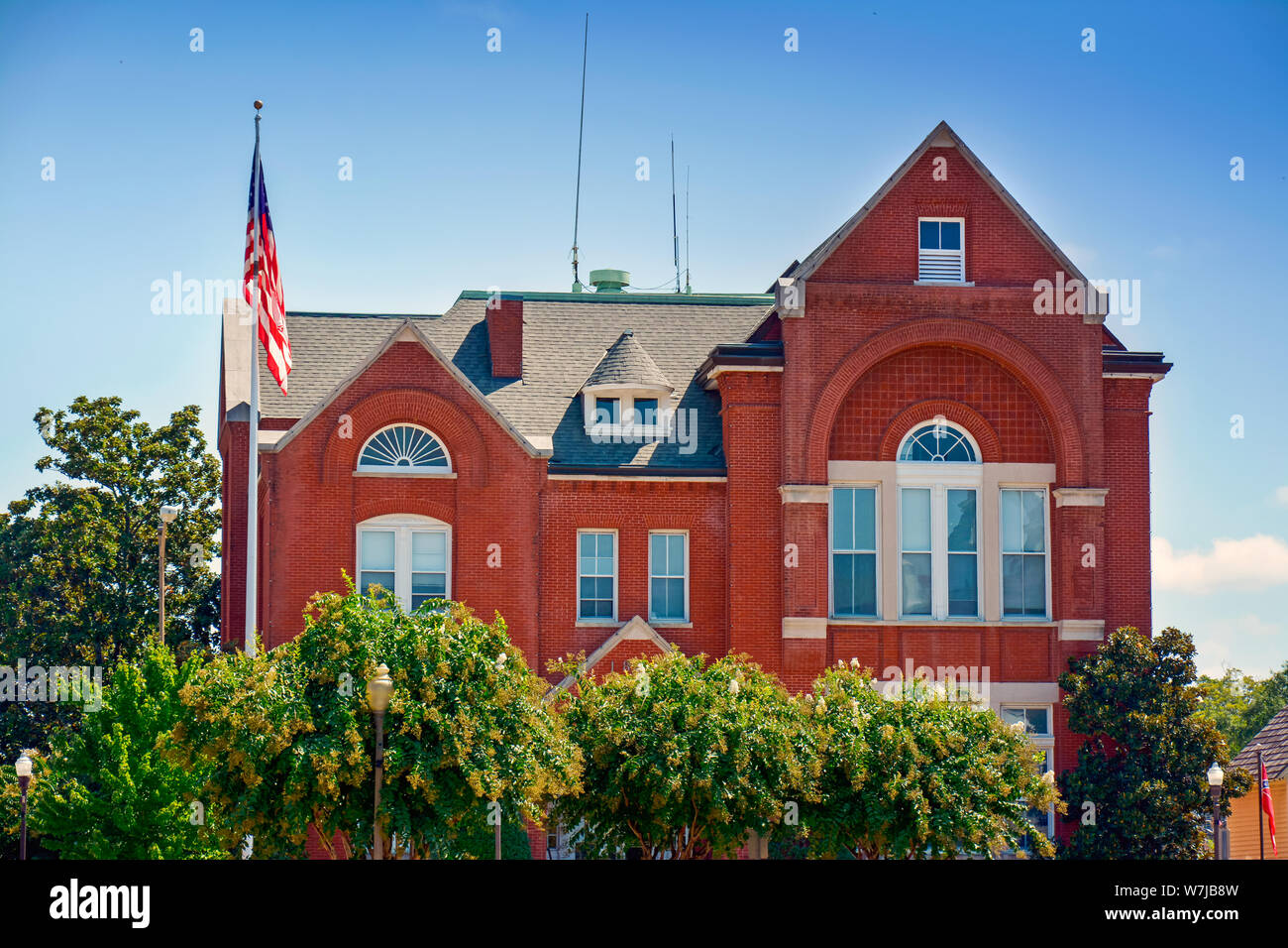 This Romanesque Revival style building, shrouded by Linden Trees, is