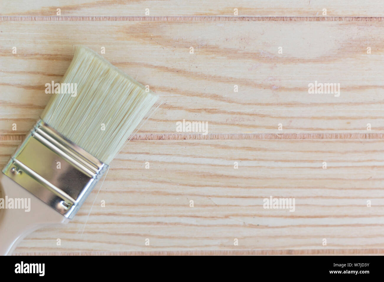 Paint brush on wooden table with copy space Stock Photo - Alamy