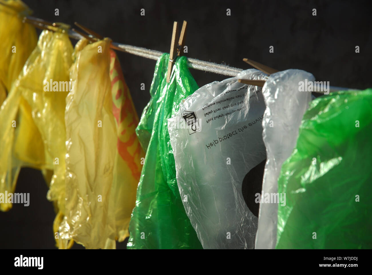 Plastic Carrier Bags hanging out to dry on a washing line, Mwandi
