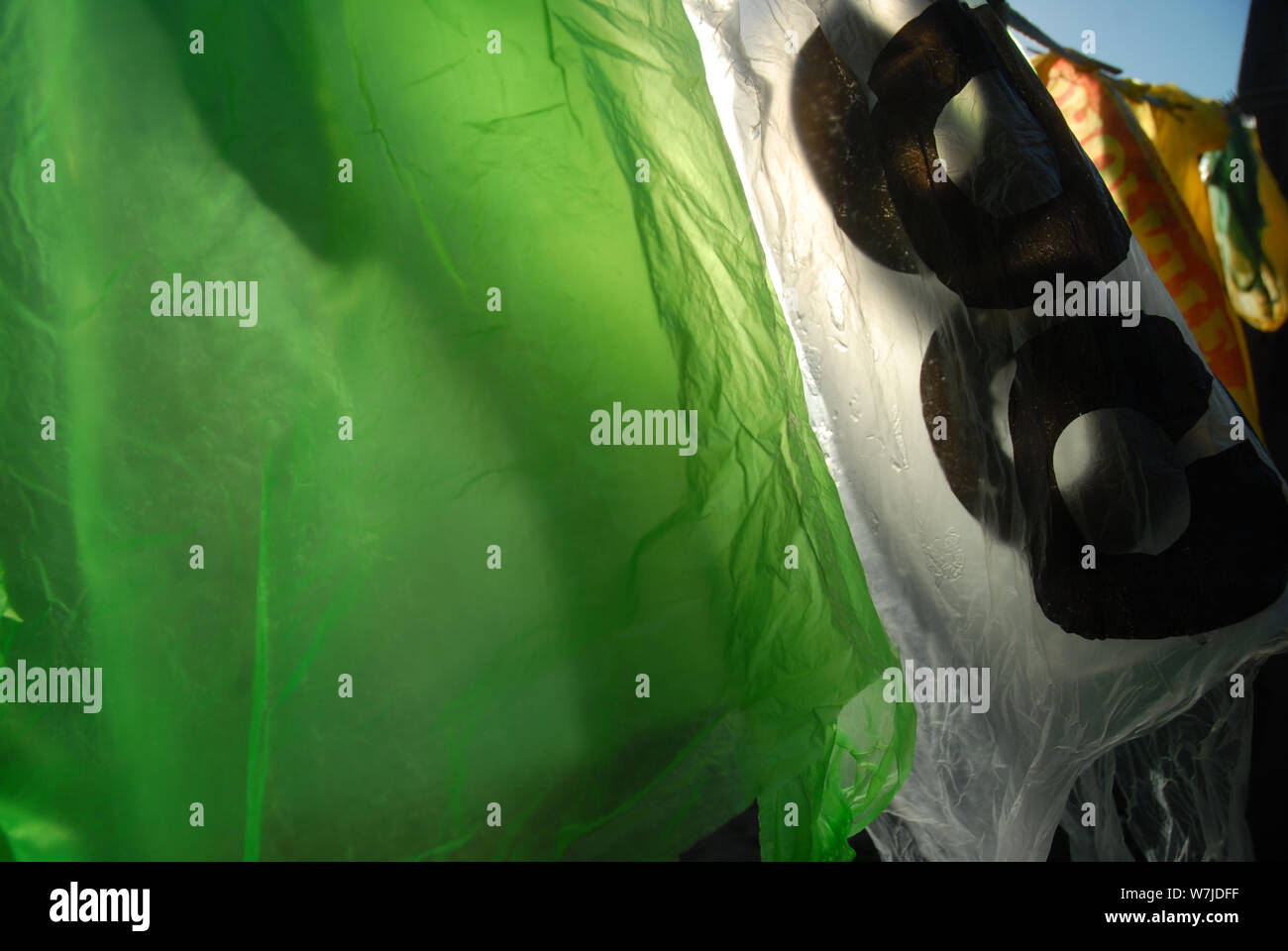 Plastic Carrier Bags hanging out to dry on a washing line, Mwandi