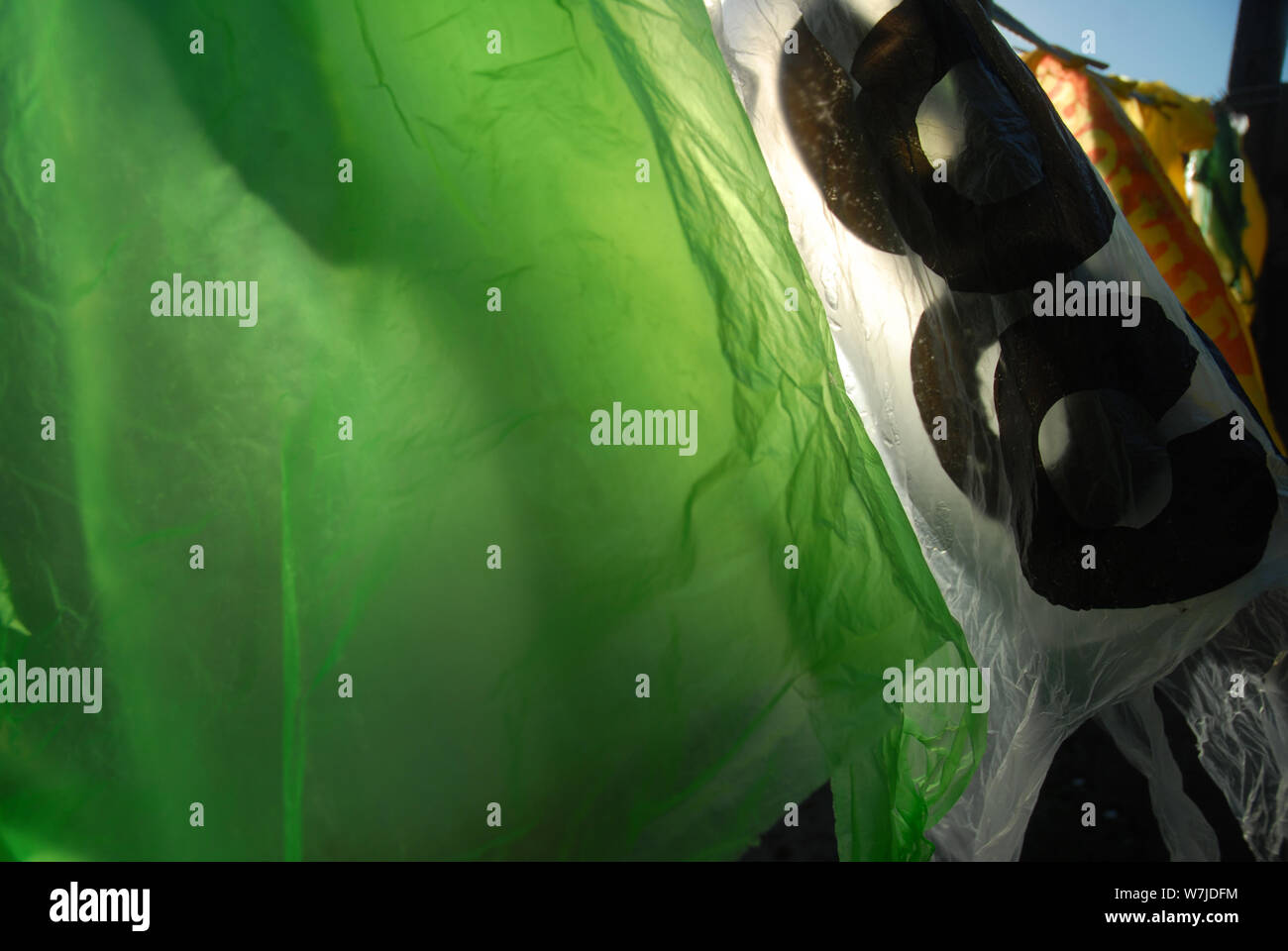 Plastic Carrier Bags hanging out to dry on a washing line, Mwandi