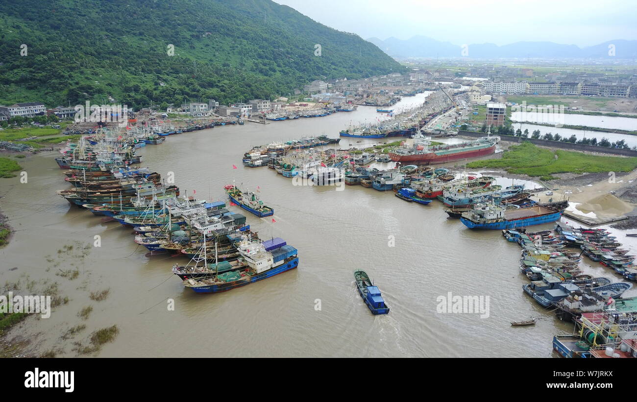 In This Aerial View Fishing Boats Are Docked At A Harbor In 