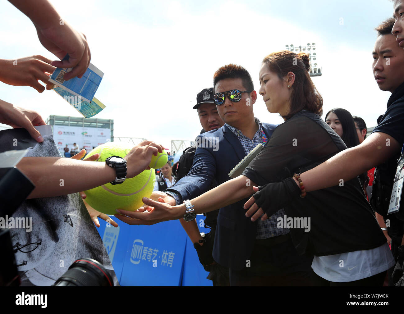 Chinese two-time Grand Slam champion Li Na, center, signs autographs for fans during the 2017 WTA Wuhan Open Project event in Wuhan city, central Chin Stock Photo