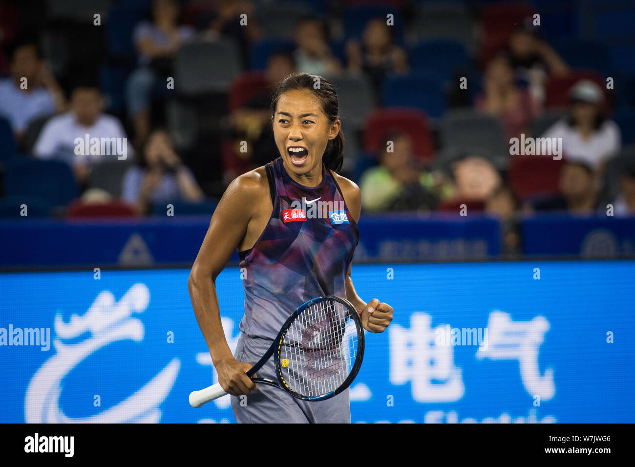 Zhang Shuai of China reacts after scoring against Donna Vekic of