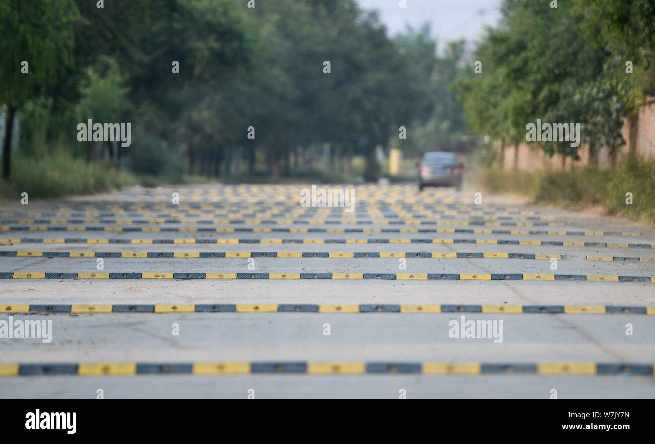 A car drives on a 200meterlong "washboard road" with more than 100