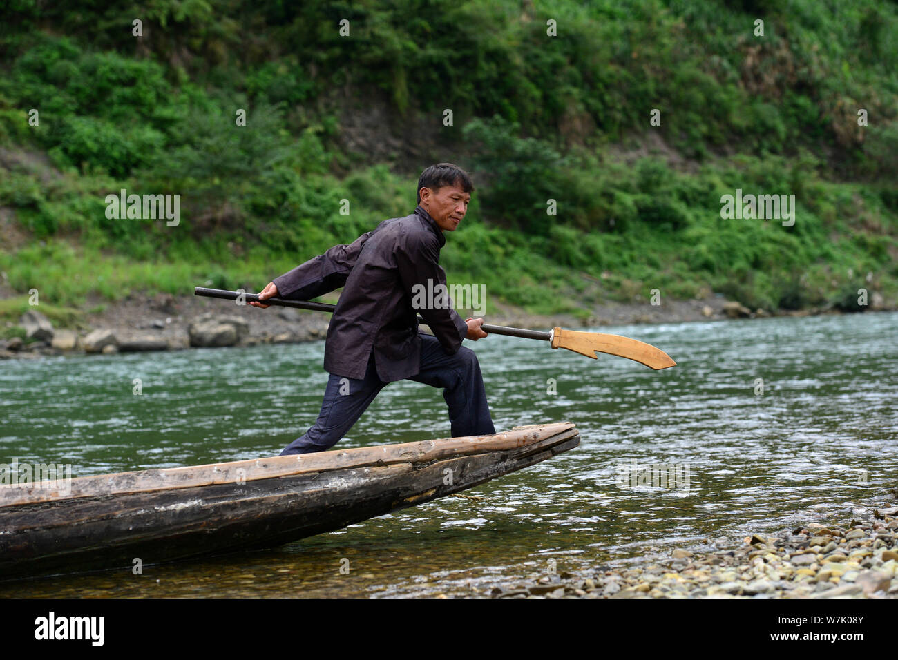 A Chinese villager of Miao ethnic group wearing traditional costumes  practises ''Miao stickfighting'', a unique martial art of the Miao Martial  Arts i Stock Photo - Alamy