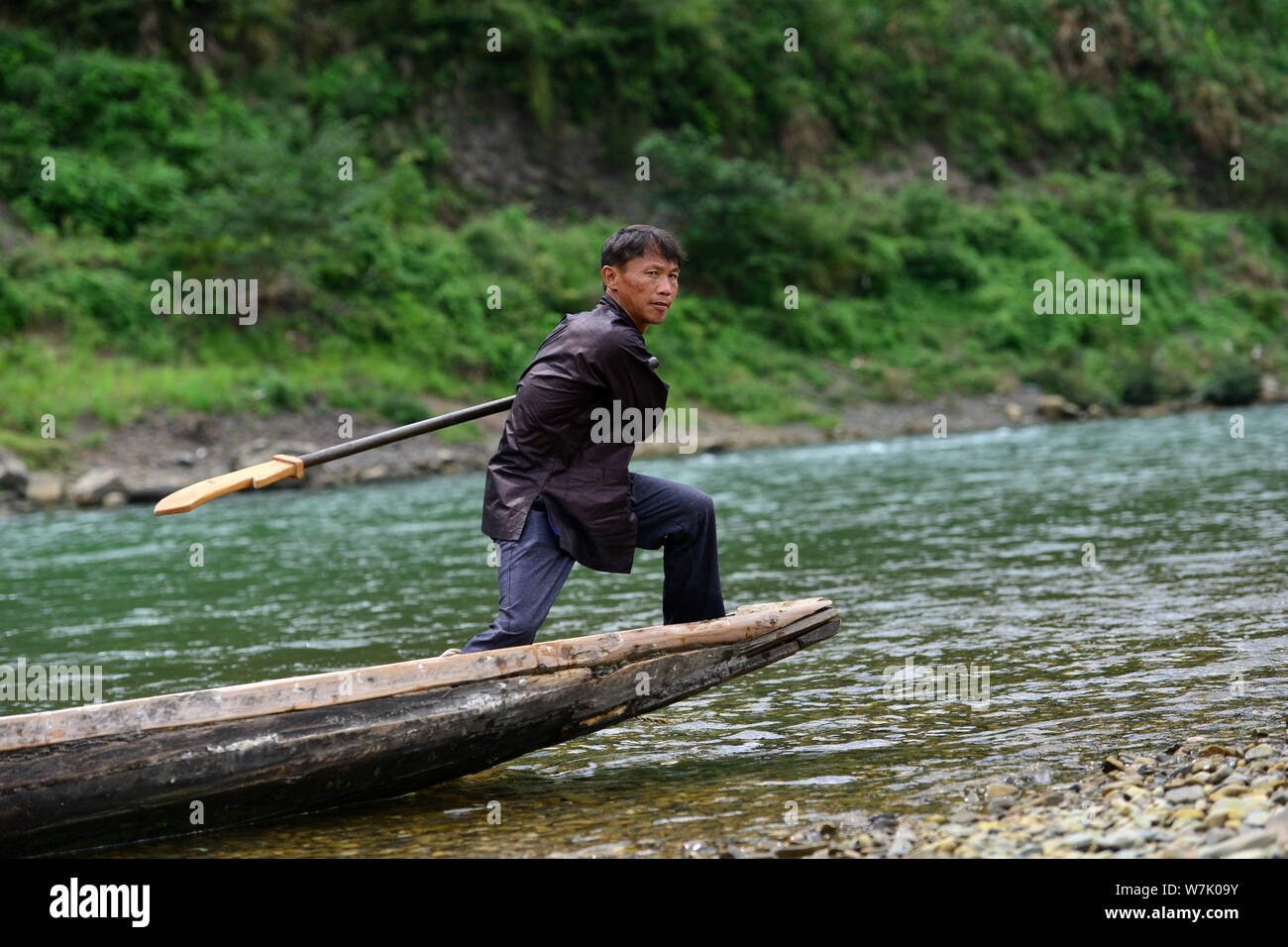 A Chinese villager of Miao ethnic group wearing traditional costumes  practises ''Miao stickfighting'', a unique martial art of the Miao Martial  Arts i Stock Photo - Alamy