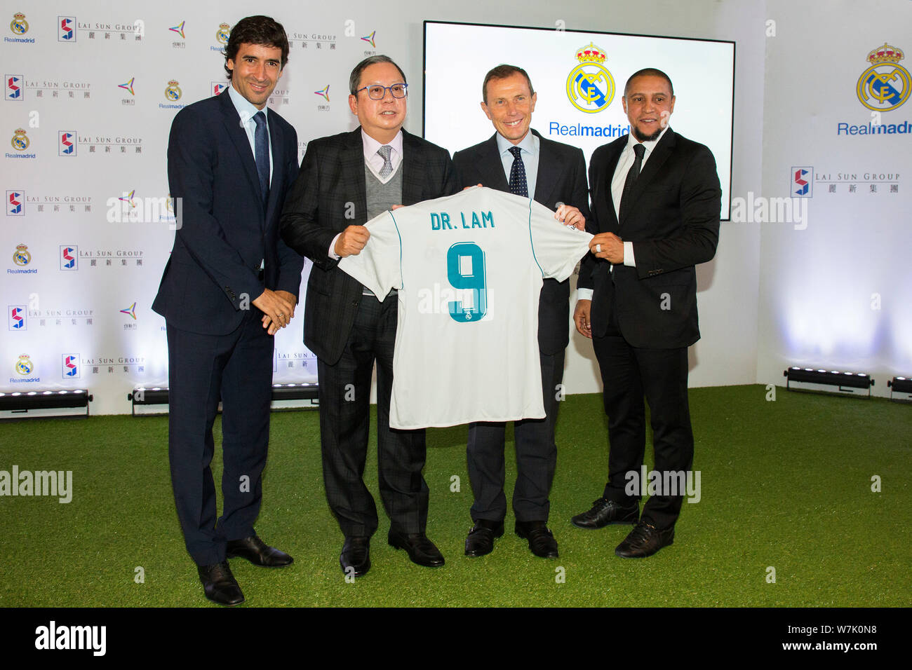 (From left) Retired Spanish football player Raul Gonzalez, Peter Lam, president of Lai Sun Group, Emilio Butragueno, director of Institutional Relatio Stock Photo