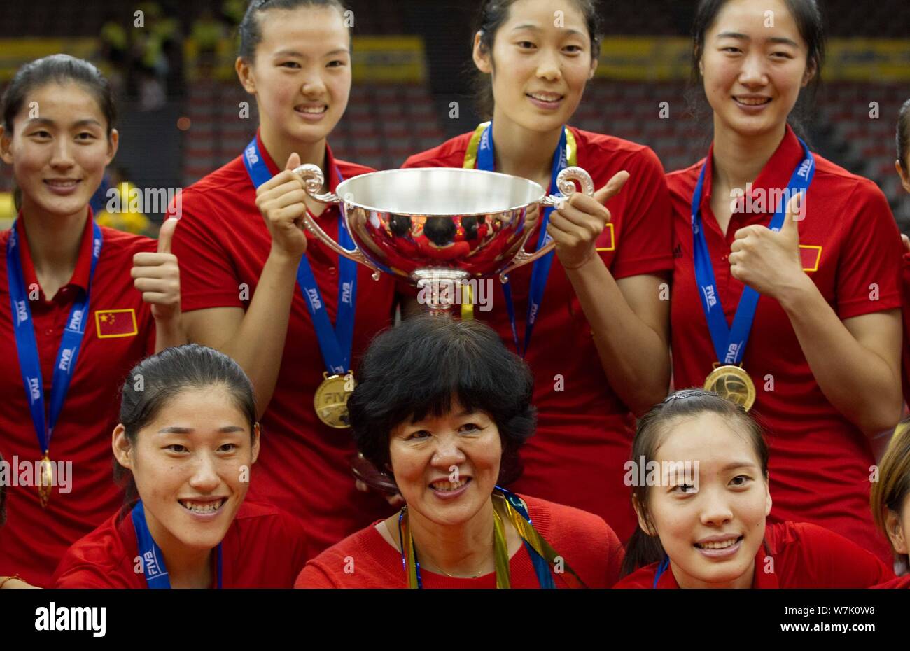 Winner the Chinese women's national volleyball team members pose with