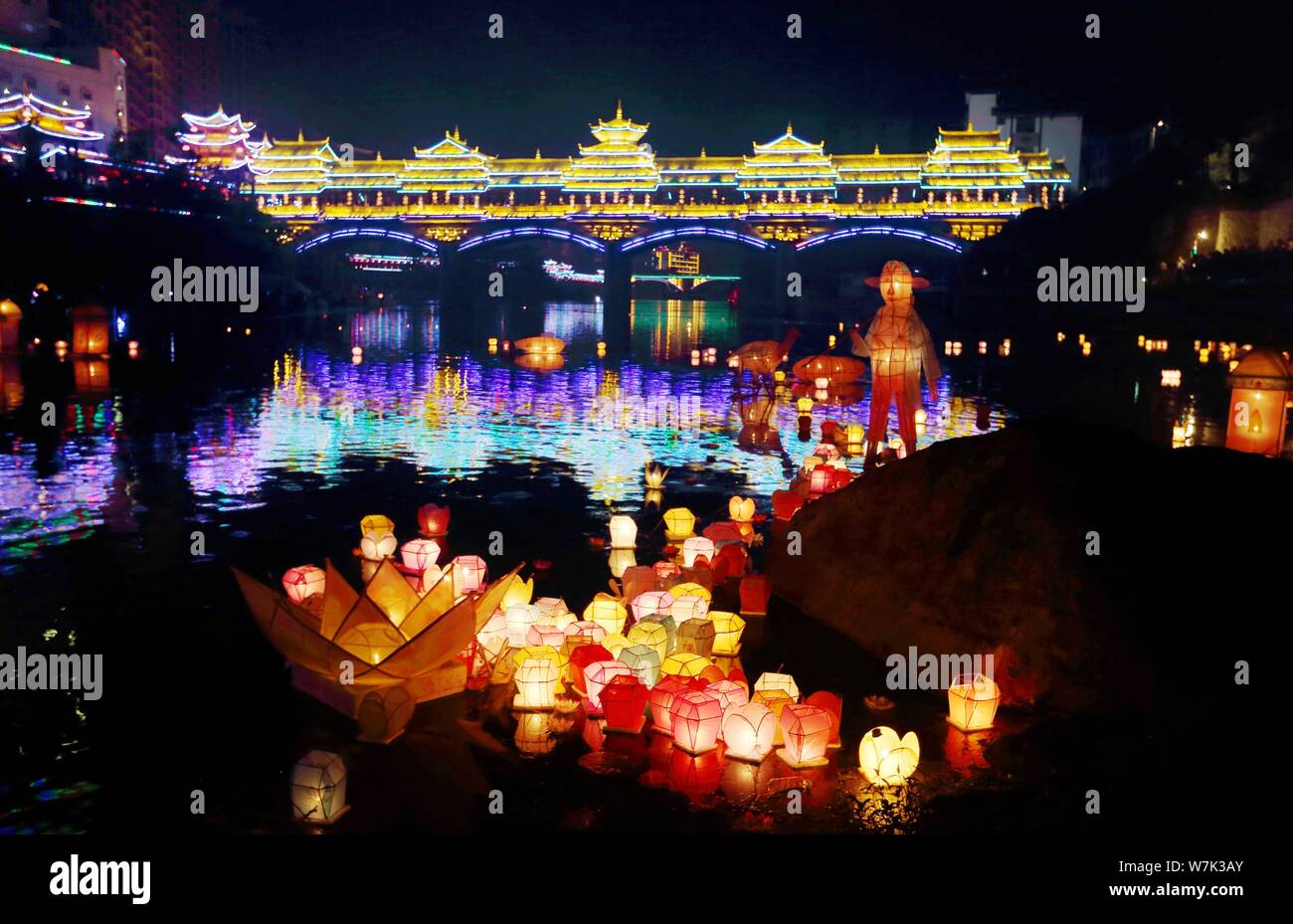 Lanterns float along the Zijiang River after being released by local