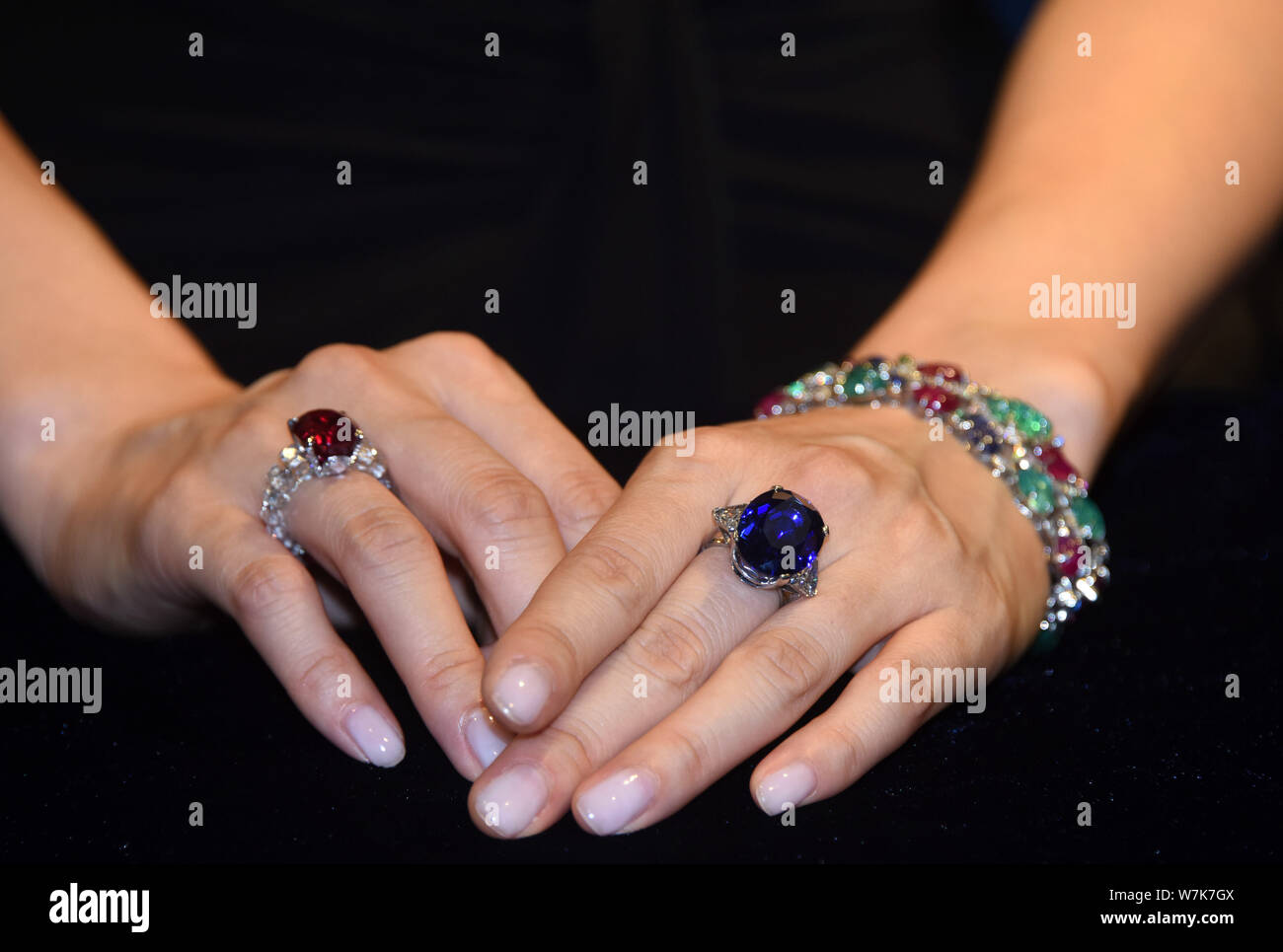 A model displays a Cartier Art Deco gem set and diamond Tutti Frutti bracelet an 8.49 carat ruby ring by JAR and a sapphire and diamond ring by Bul Stock Photo Alamy