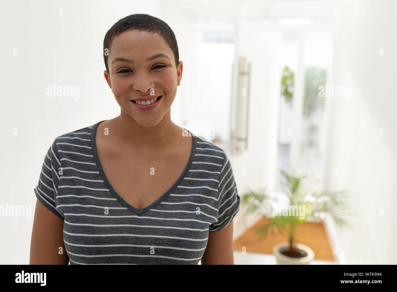 Happy young woman smiling hi-res stock photography and images - Alamy