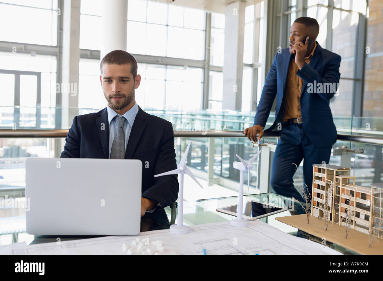 Two businessmen working in a modern office Stock Photo