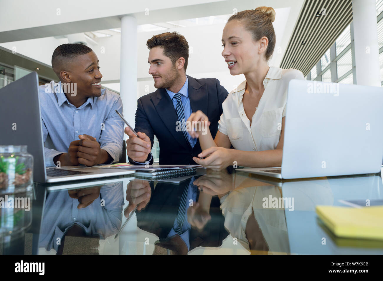 Diverse male female colleagues desk hi-res stock photography and images ...