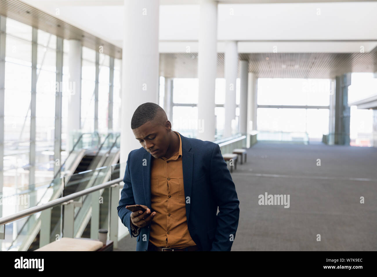 Businessman using smartphone at work Stock Photo