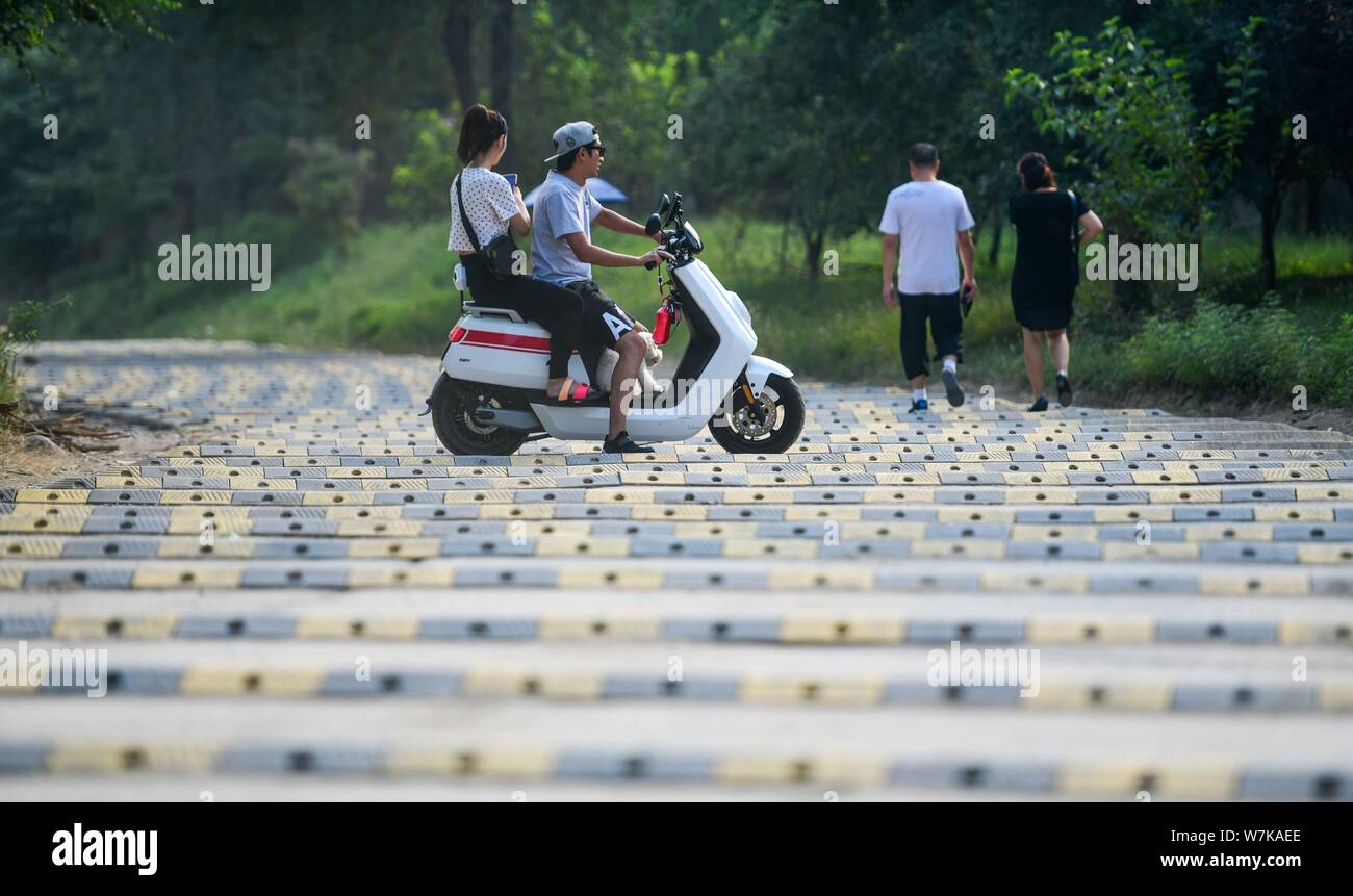 A cyclist rides on a 200meterlong "washboard road" with more than 100
