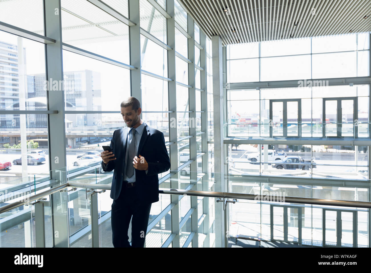 Businessman using smartphone at work Stock Photo