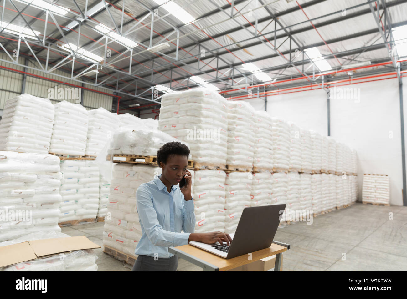 Female manager warehouse talking mobile hi-res stock photography and ...