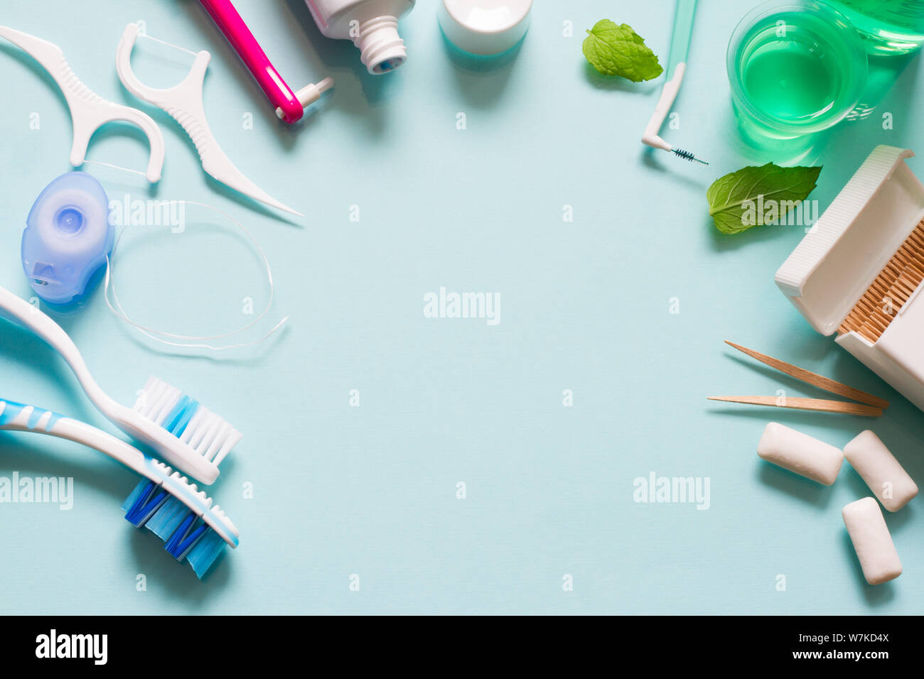 Teeth care frame concept with manual toothbrushes and oral hygiene products Stock Photo