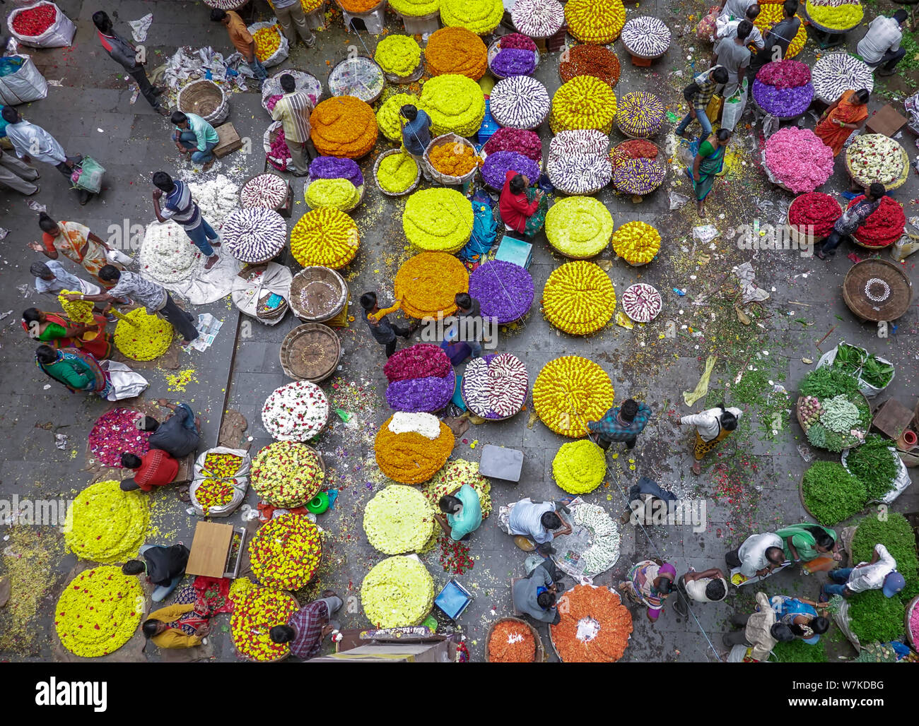 People selling Fresh flowers in wholesale inside KR flower market India