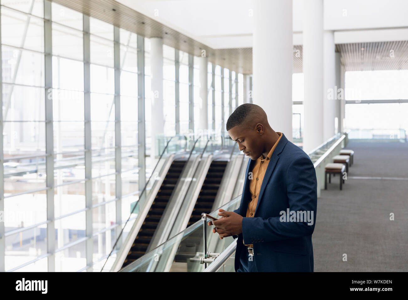 Businessman using smartphone at work Stock Photo