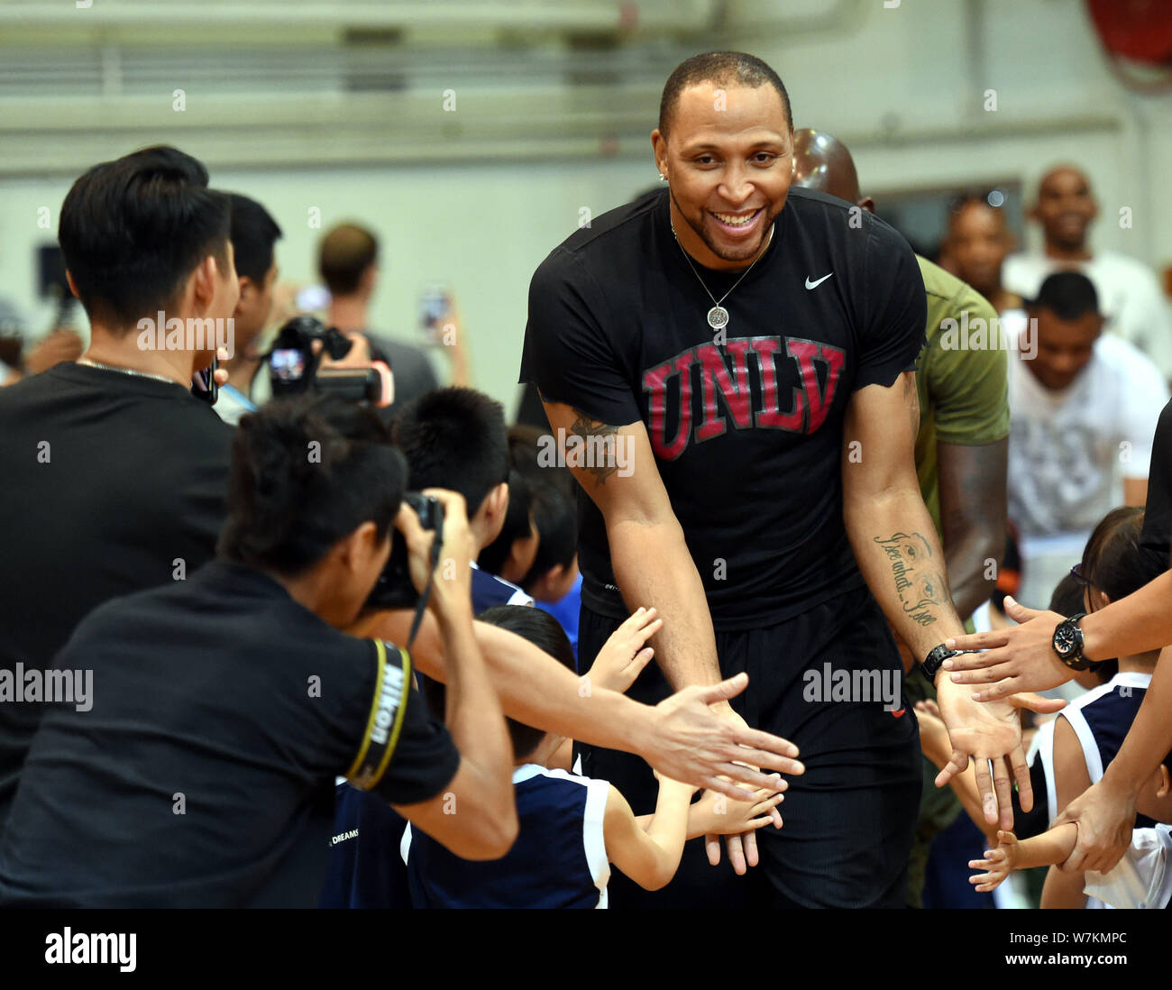 NBA star Shawn Marion interacts with younger players during a