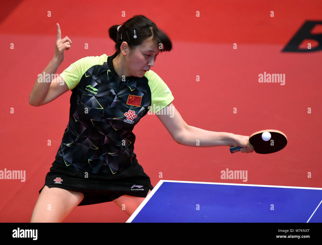 Qian Tianyi of China returns a shot to Soma Yumeno of Japan in their Junior Girls Singles match during the 2017 ITTF World Junior Circuit Hong Kong Ju Stock Photo